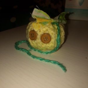 A pumpkin keychain and ornaments